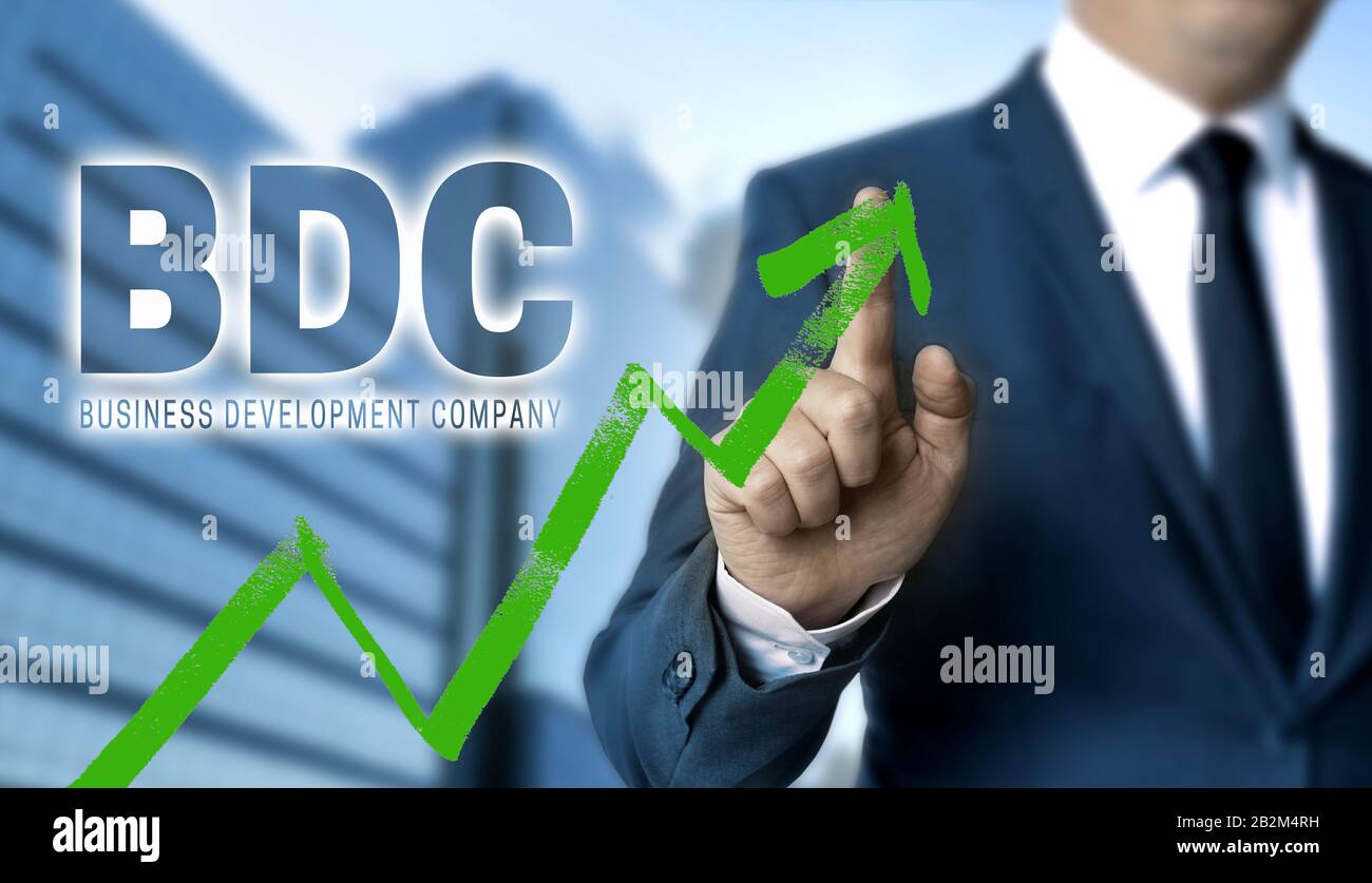 El concepto BDC es mostrado por el hombre de negocios. Foto de stock