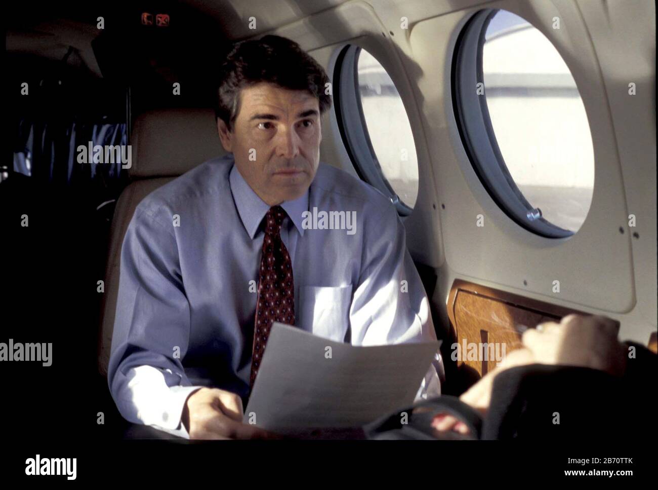 Texas, 2002 de enero: Gobernador de Texas. Rick Perry, volando en un avión privado, se prepara para una campaña de aparición ©Bob Daemmrich Foto de stock