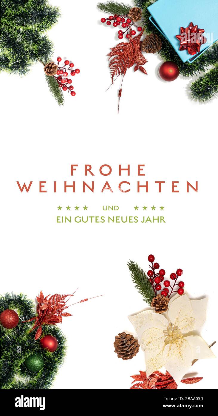 “Frohe Weihnachten und ein gutes neues Jahr” t.i. Feliz Navidad y Feliz año Nuevo en alemán sobre un fondo ligero con decoración Smartpho Foto de stock