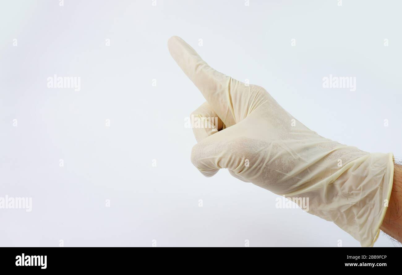 La mano del médico lleva guantes para la serie de virus de corona Foto de stock