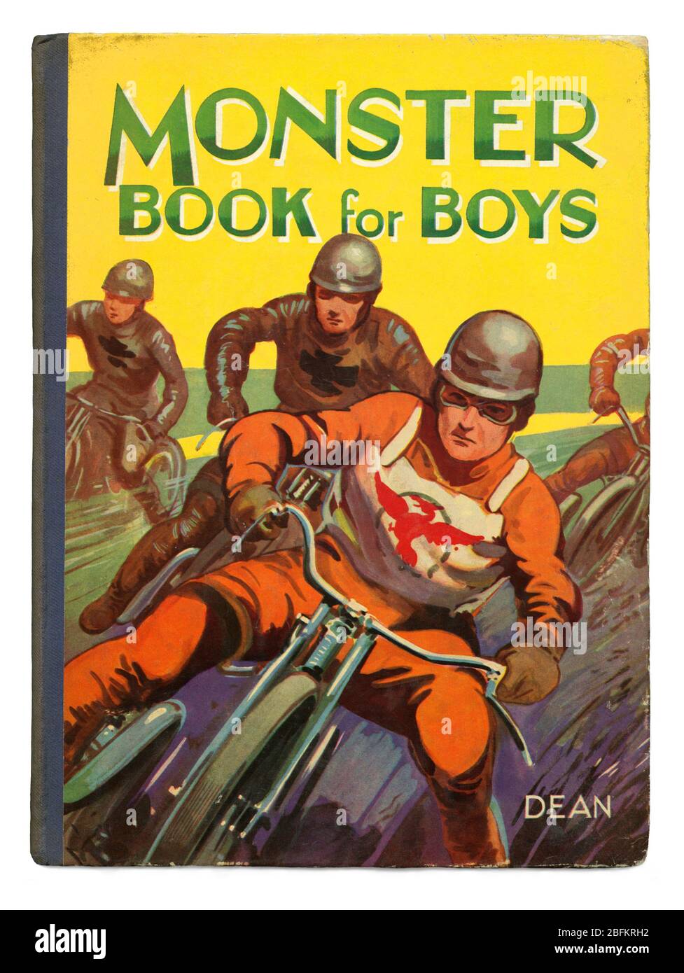 Portada del Monster Book for Boys c. 1950 publicado por Dean and son Ltd, Londres, Inglaterra, Reino Unido. Los libros de antología y los anuarios como éste eran a menudo el regalo básico de Navidad de una niñez británica de la posguerra. La serie Monster Book fue una colección de historias y este título incluía una ilustración de carreras de motocicletas en la portada. El circuito (carreras de pista o carreras de tierra en Norteamérica) es un deporte popular (especialmente en el norte de Europa) y las carreras consisten en vueltas de un suave cinder de superficie, esquisto o circuito oval de tierra. Foto de stock