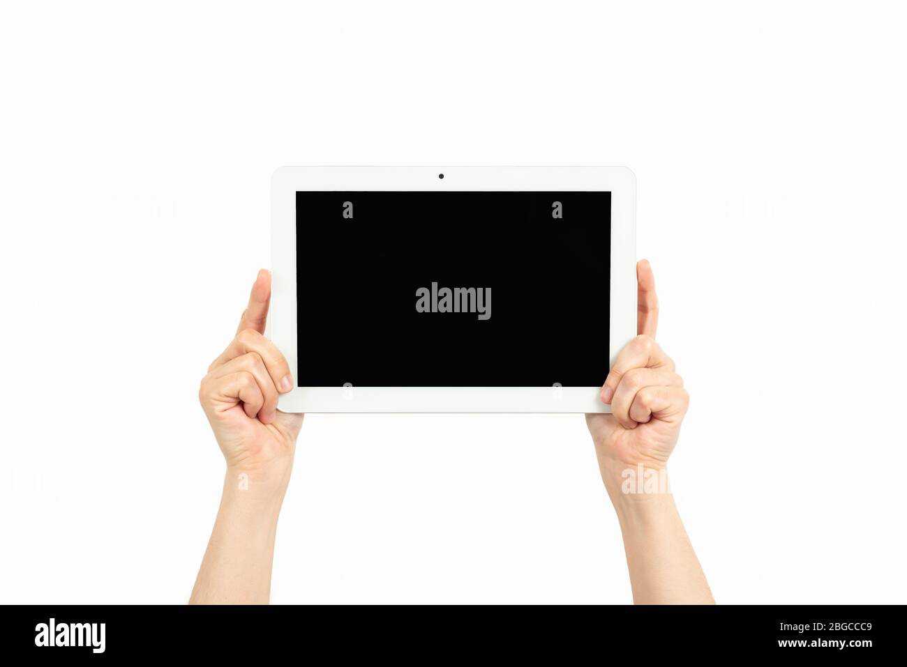 la mujer tiene las manos sosteniendo una tableta sobre un fondo blanco Foto de stock