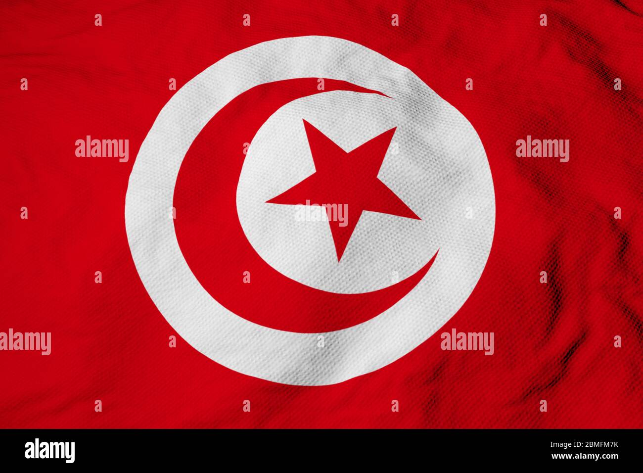 Primer plano de fotograma completo en una bandera tunecina que ondea en la presentación en 3D. Foto de stock