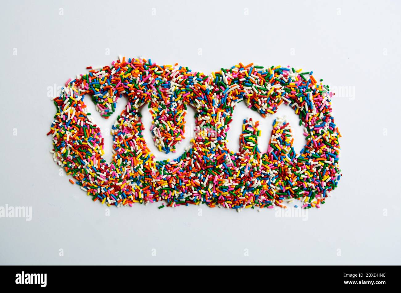 Arte de caramelo DE YUM creado con salpicaduras de arco iris Foto de stock