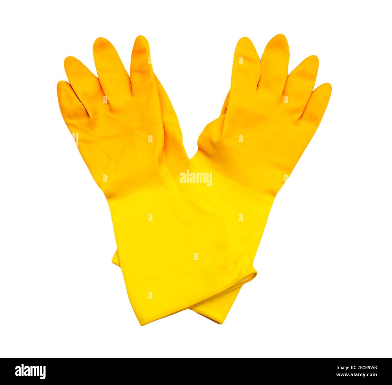 Un par de guantes de goma amarilla para la limpieza del hogar Foto de stock