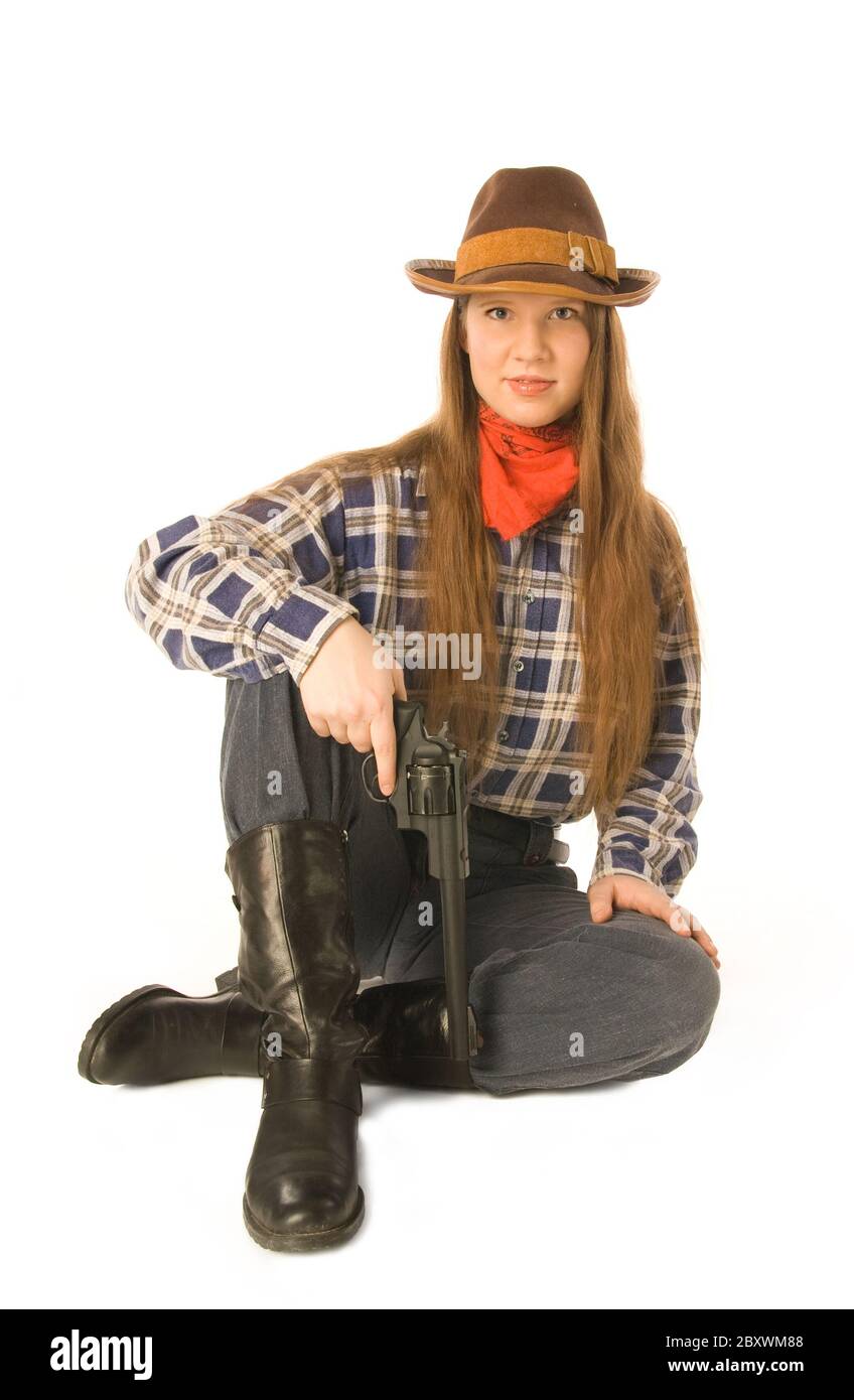 Mujer joven vistiendo prendas vaqueras una pistola Fotografía de stock -  Alamy