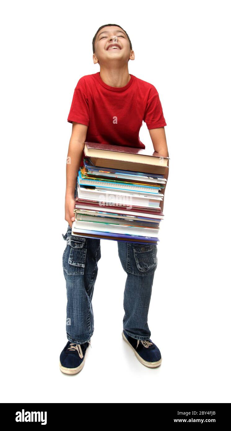 niño asiático con pila de libros Foto de stock