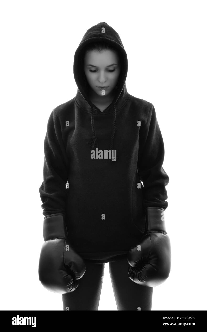 Chica muy bonita en un chándal negro con un saco de boxeo y guantes de boxeo:  fotografía de stock © fxquadro #402570100