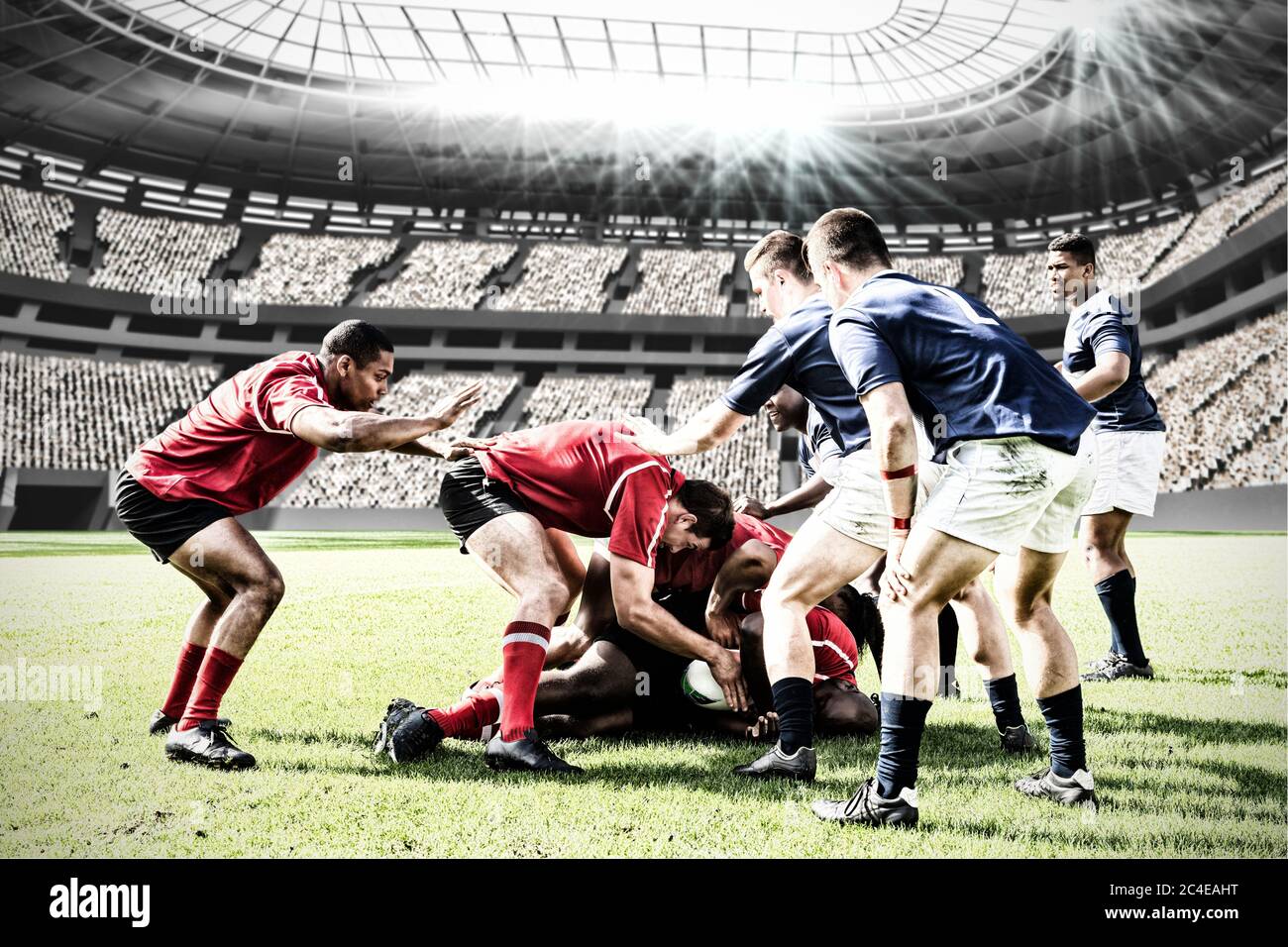 Imagen digital compuesta del equipo de jugadores de rugby enfrentándose para ganar el balón en estadios deportivos Foto de stock