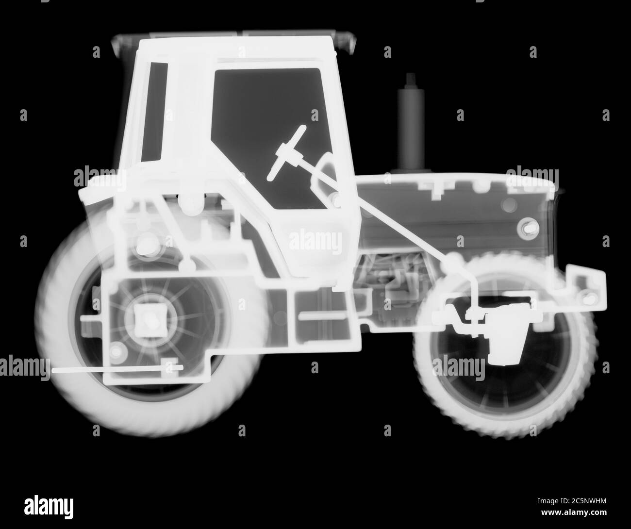 Tractor de juguete, rayos X. Foto de stock