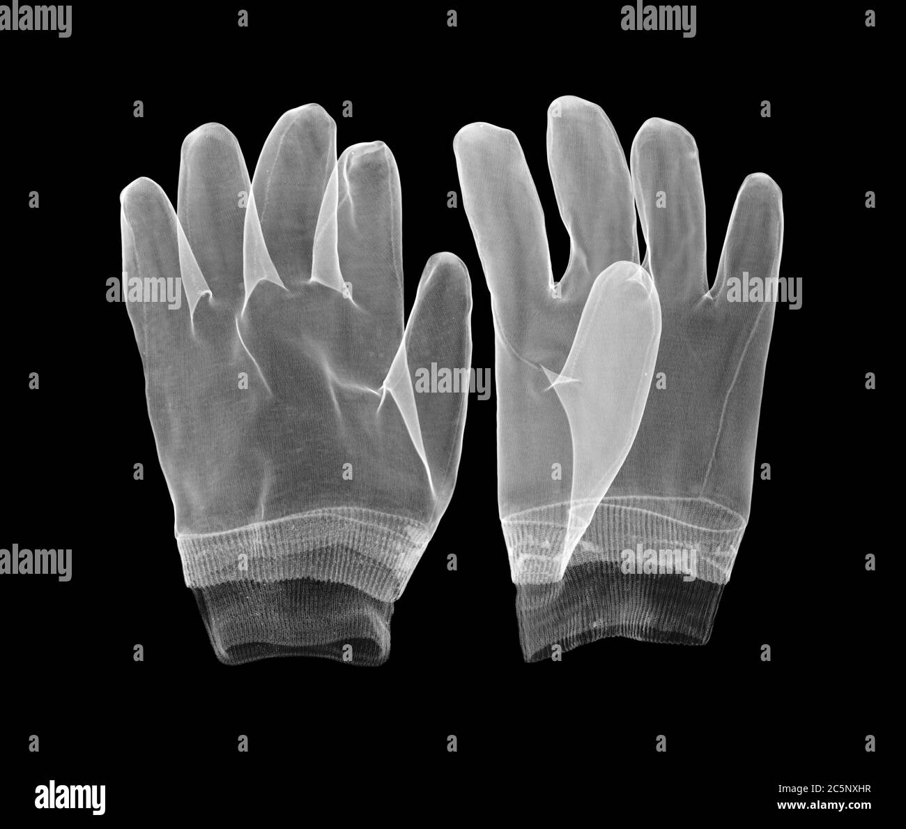 Par de guantes de trabajo de goma, rayos X. Foto de stock