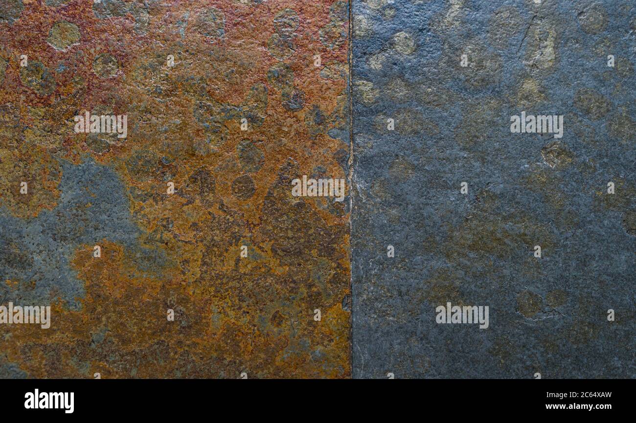 Textura de piedra gris azulada con manchas de óxido metálico. Foto de stock