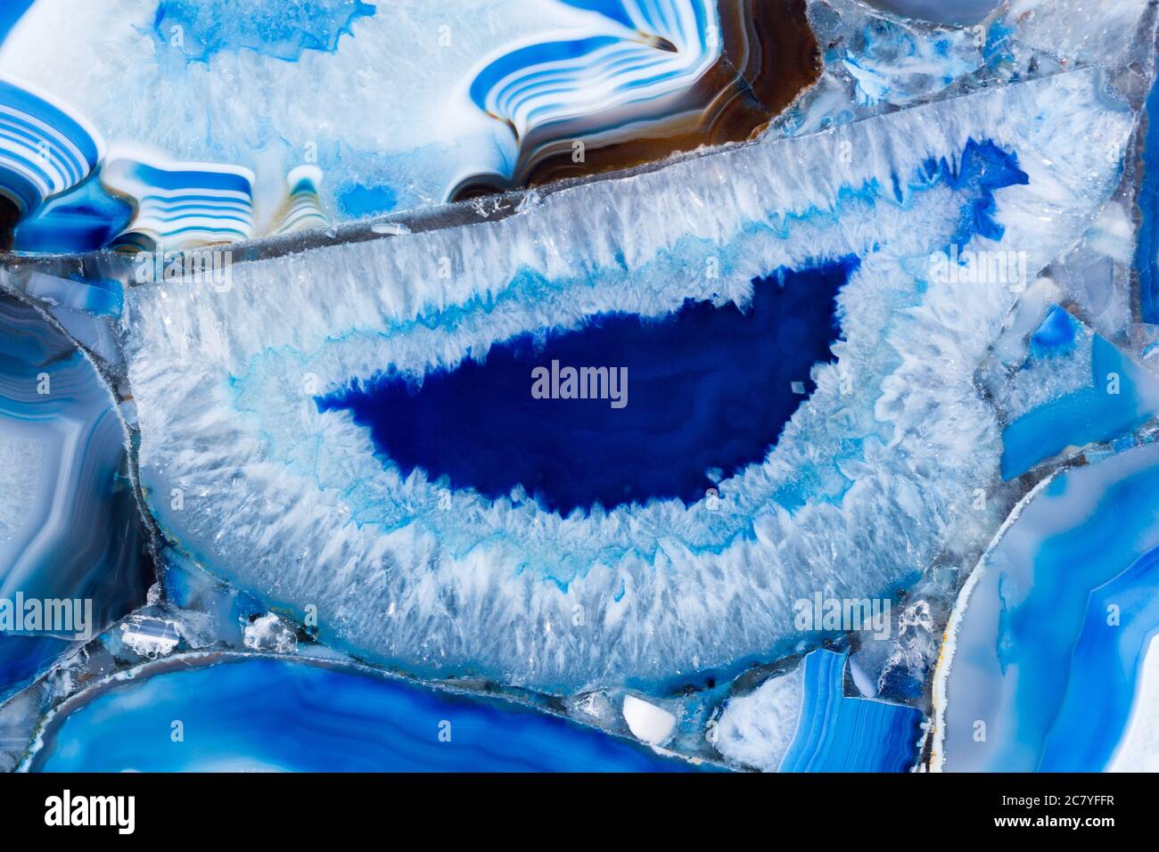Elegante textura de agat en una superficie de color azul delicioso. Foto de stock