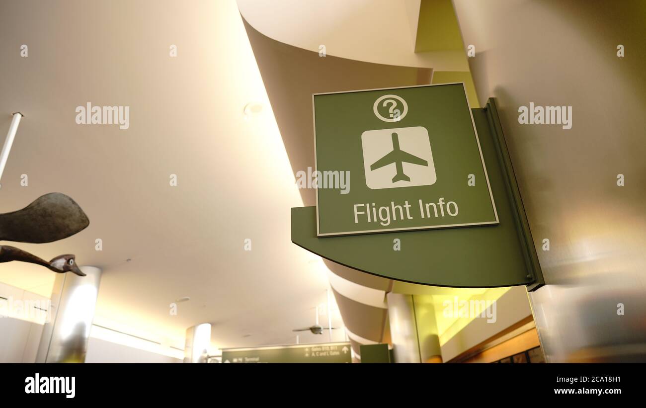 Icono de avión en el signo verde para el área de información en el aeropuerto Foto de stock