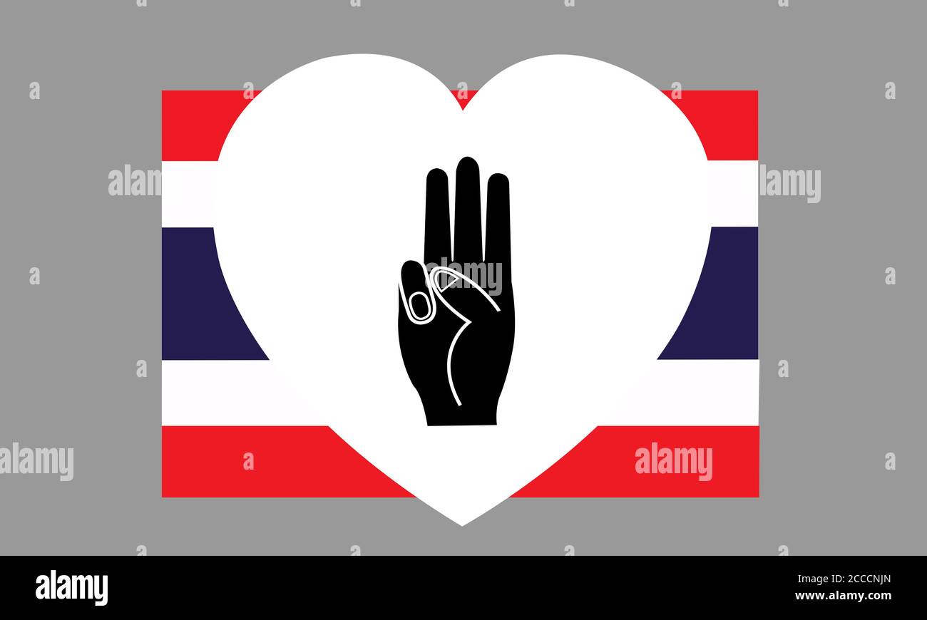 Levanta 3 dedos en un corazón blanco sobre la bandera tailandesa. Símbolo de la expresión política contra la dictadura. Foto de stock