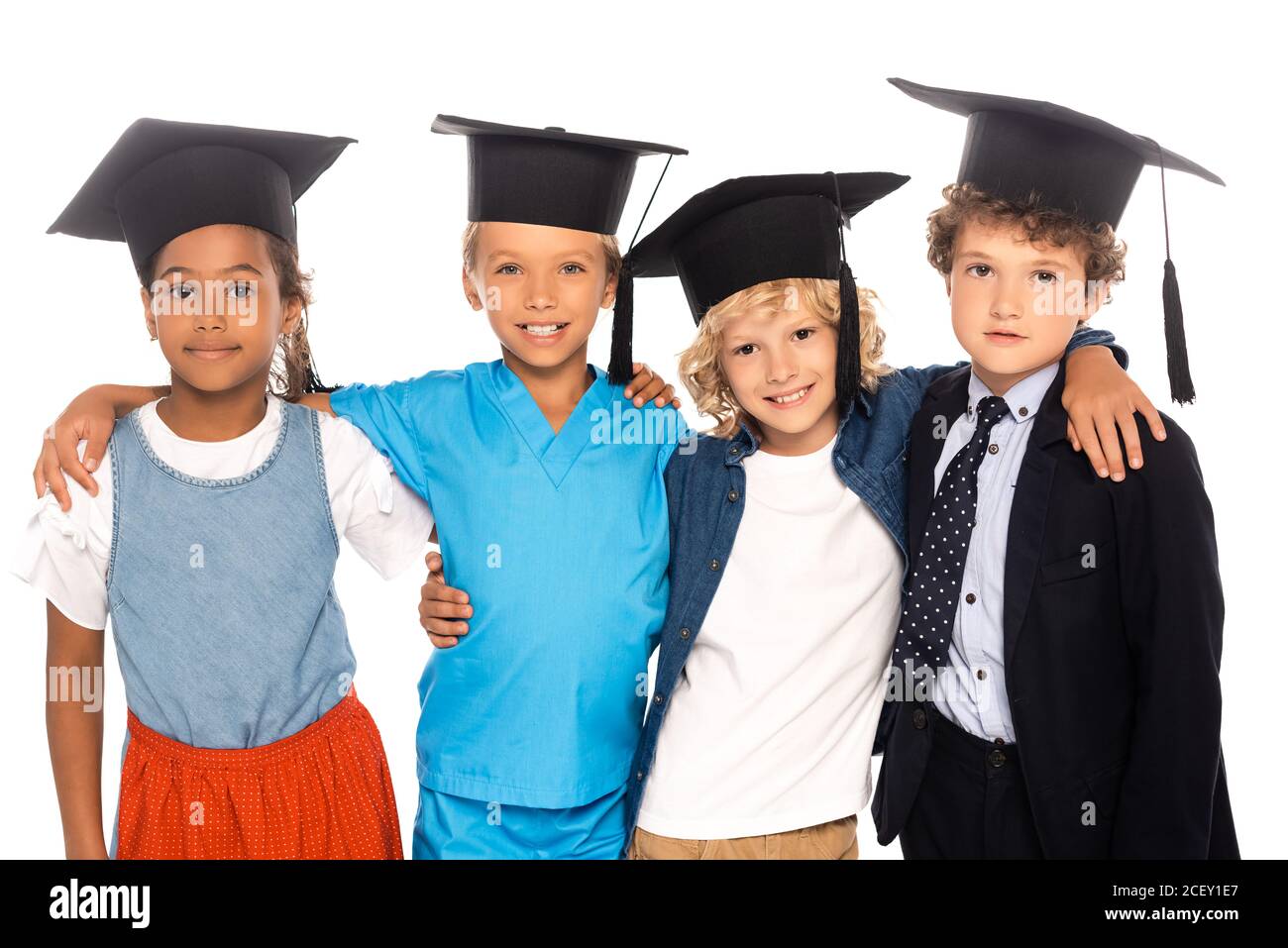 niños multiculturales en gorras de graduación vestidos con trajes de  diferentes profesiones aisladas sobre blanco Fotografía de stock - Alamy