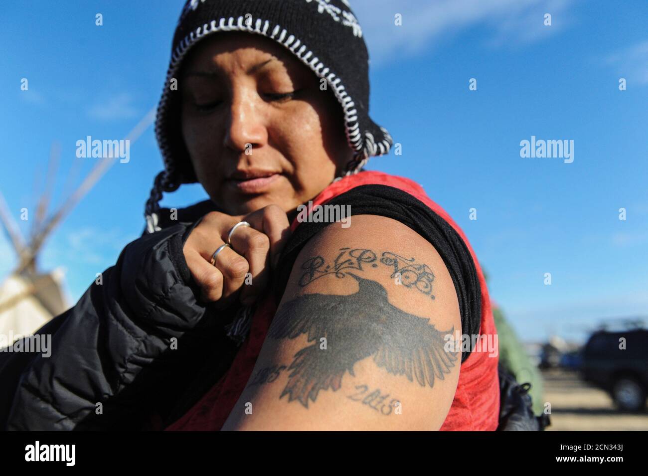 A woman from the Cheyenne River Sioux tribe displays her Native American  tattoo of a blackbird during a protest against plans to pass the Dakota  Access pipeline near the Standing Rock Indian