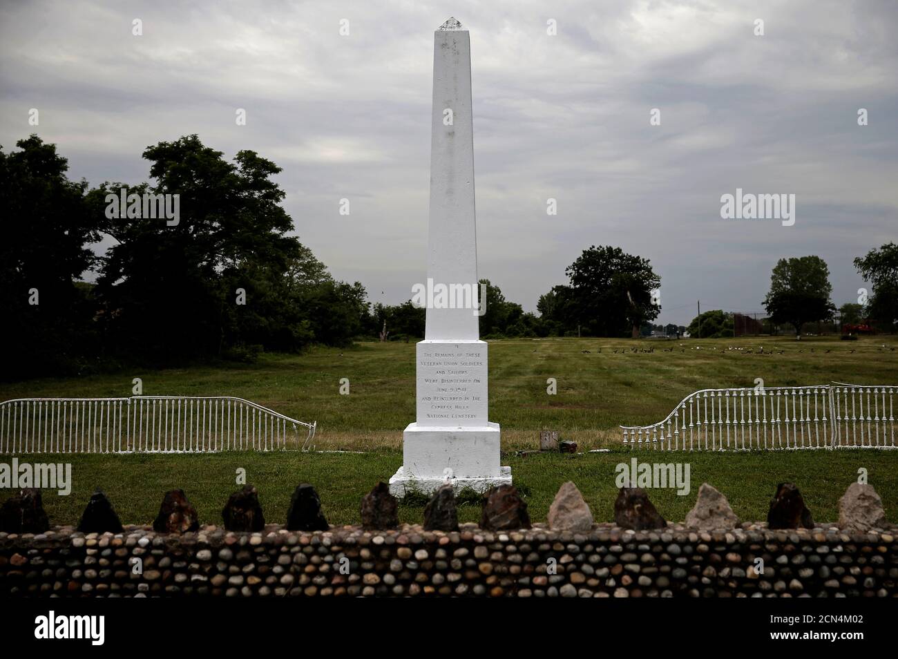 A monument to civil war soldiers buried in mass graves stands on Hart