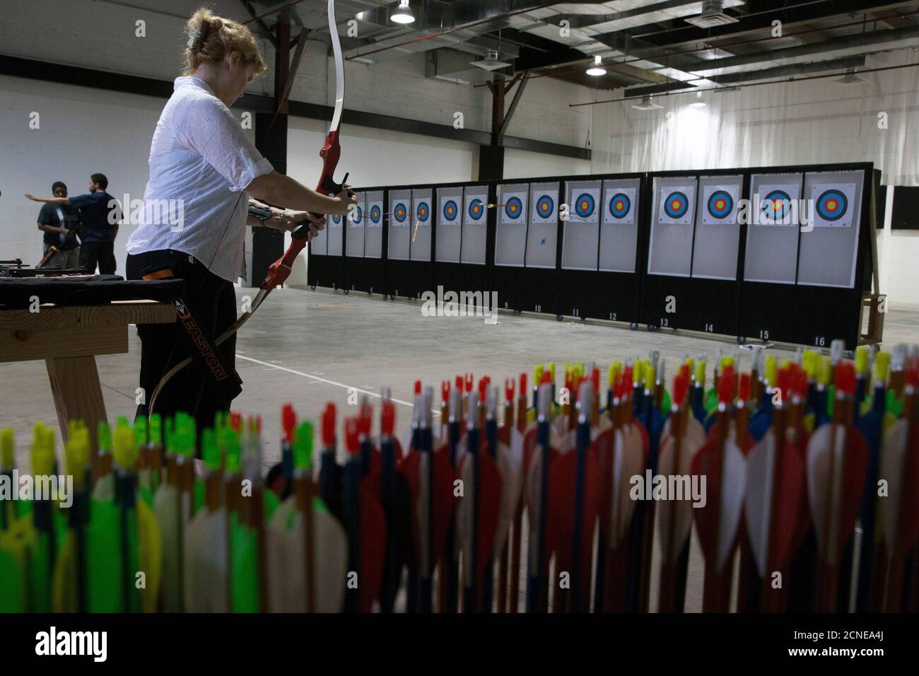 Randee Kestenbaum Prepares Her Bow At Gotham Archery An Indoor Archery Range In The Brooklyn Borough Of New York June 26 14 Bows And Arrows May Not Be The Most Likely Accessories