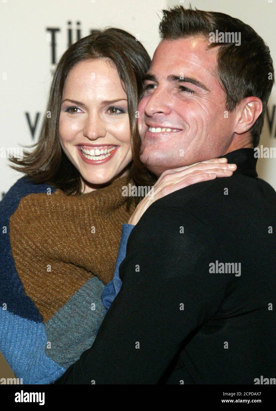 CSI: Crime Scene Investigation cast members Jorja Fox (L) and George Eads  embrace before a party at the Light nightclub in Las Vegas, Nevada on Dec.  14, 2003. The pair were fired