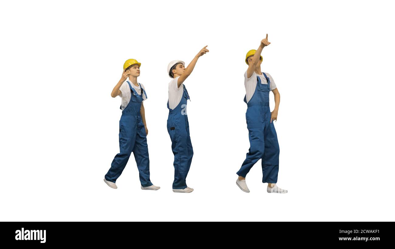 Tres jóvenes trabajadores de la construcción haciendo un divertido toque de  baile de fila Fotografía de stock - Alamy