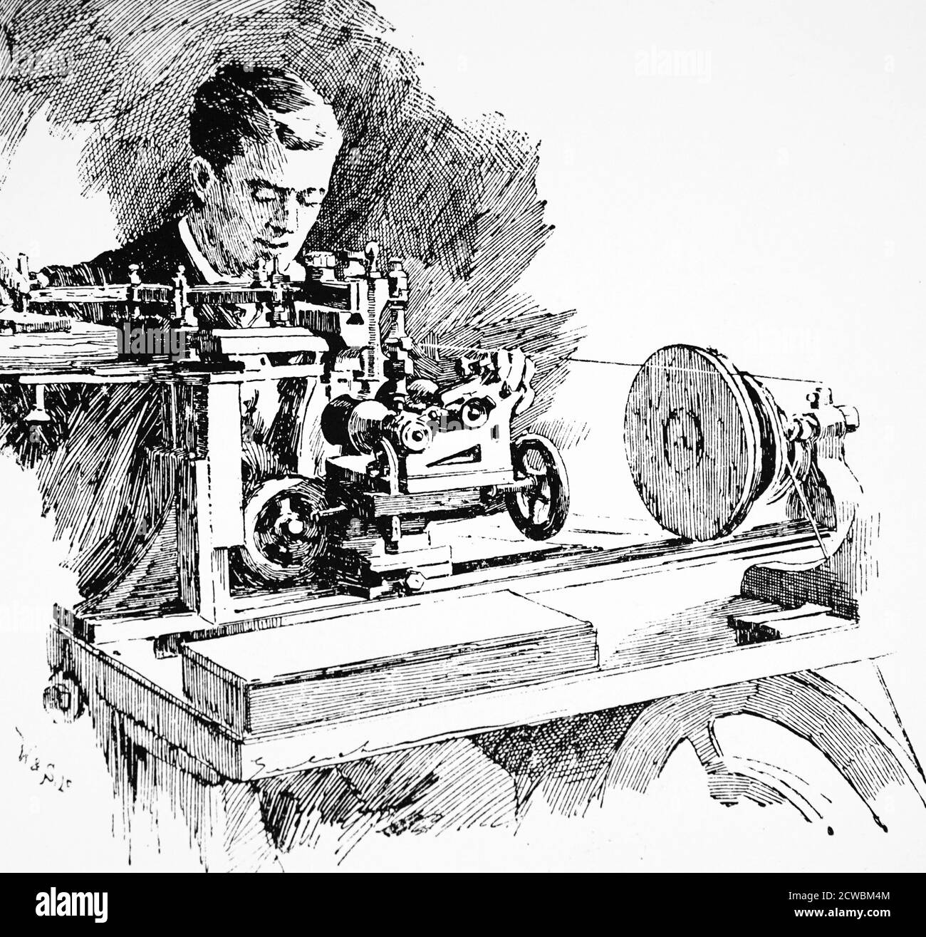 trabajador industrial que utiliza herramientas de precisión en una fábrica de ingeniería. alrededor de 1925 Foto de stock
