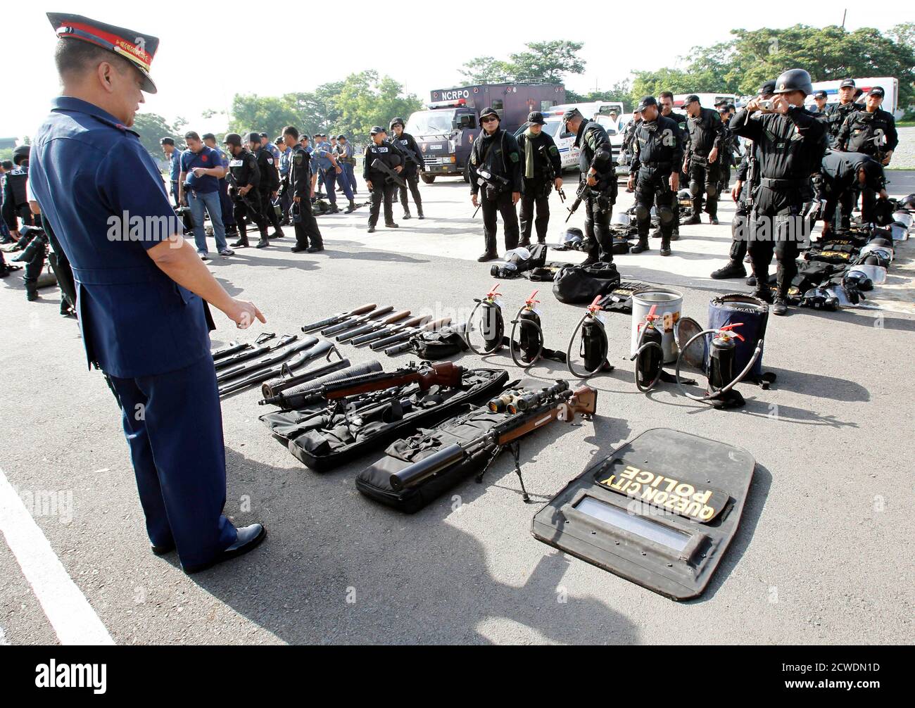 National Capital Region Police Office Ncrpo Chief Leocadio Santiago Stresses A Point While Inspecting Equipment Belonging To The Philippine National Police Pnp Special Weapons And Tactics Swat Team At A Police Headquarters