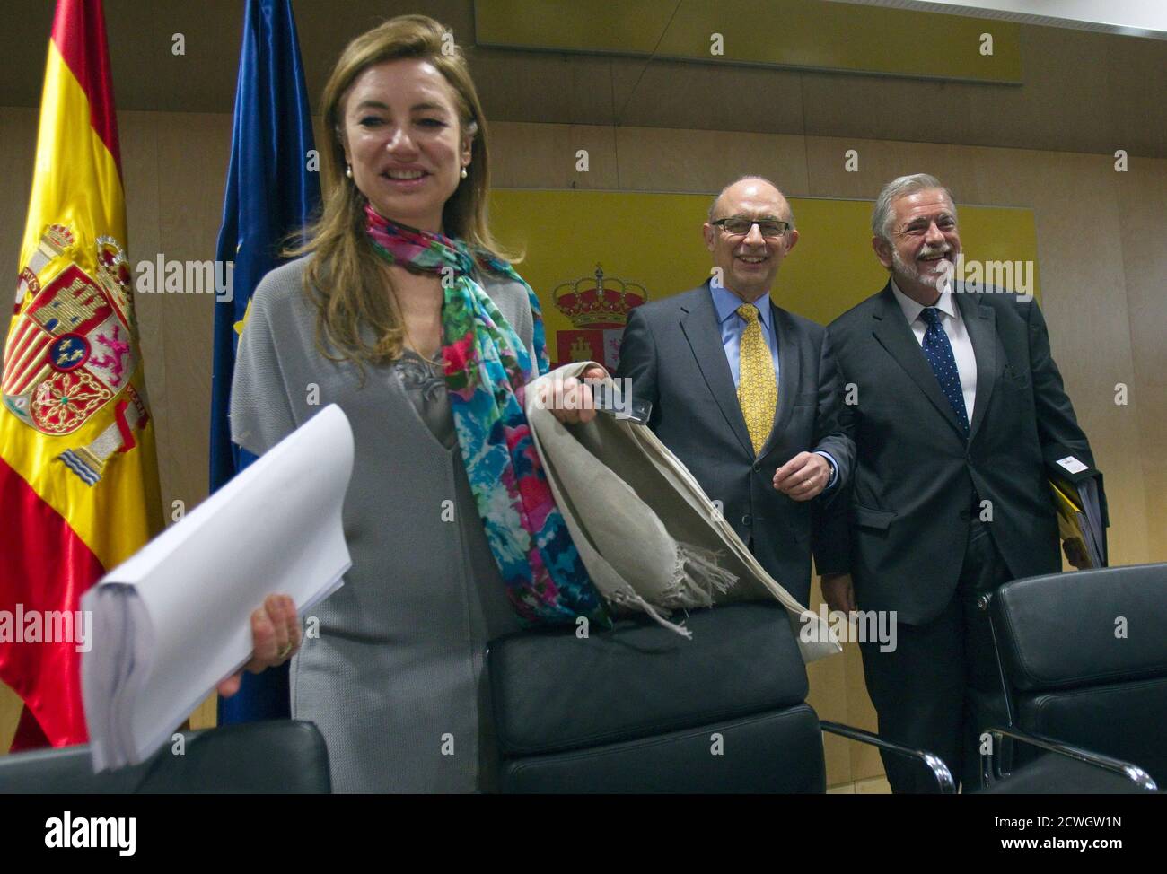 L-R) Spain's Budget Secretary Marta Fernandez Curras, Spain's Treasury  Minister Cristobal Montoro and Spain's Secretary of State for Public  Administration Antonio Beteta arrive to a meeting with heads of finance of  all
