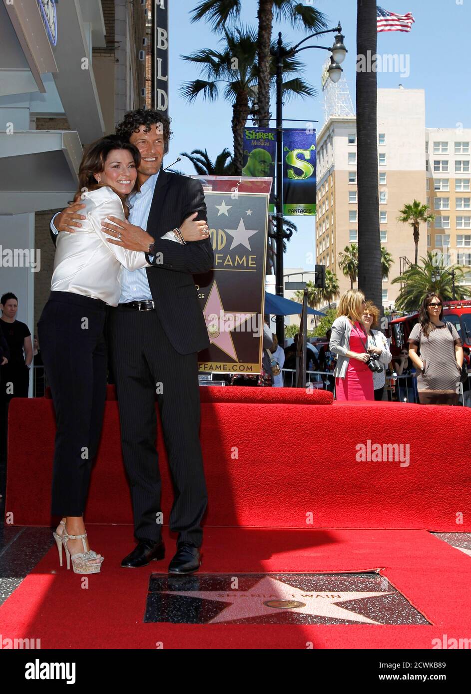 Canadian country singer Shania Twain poses with her husband Frederic