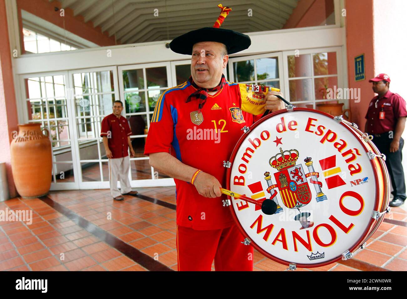 Manuel Caceres Artesero, better known as Manolo 'El del Bombo' (The drum of  Spain), one of Spain's national soccer team's supporters, plays his drum at  a hotel in Puerto La Cruz June