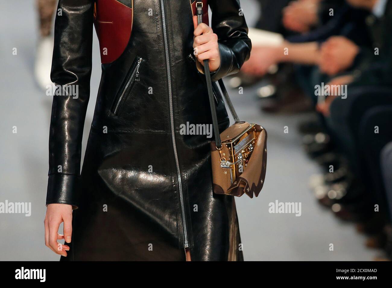 A model presents a hand bag creation by French designer Nicolas Ghesquiere  for fashion house Louis Vuitton as part of his Fall/Winter 2014-2015  women's ready-to-wear collection show during Paris Fashion Week March