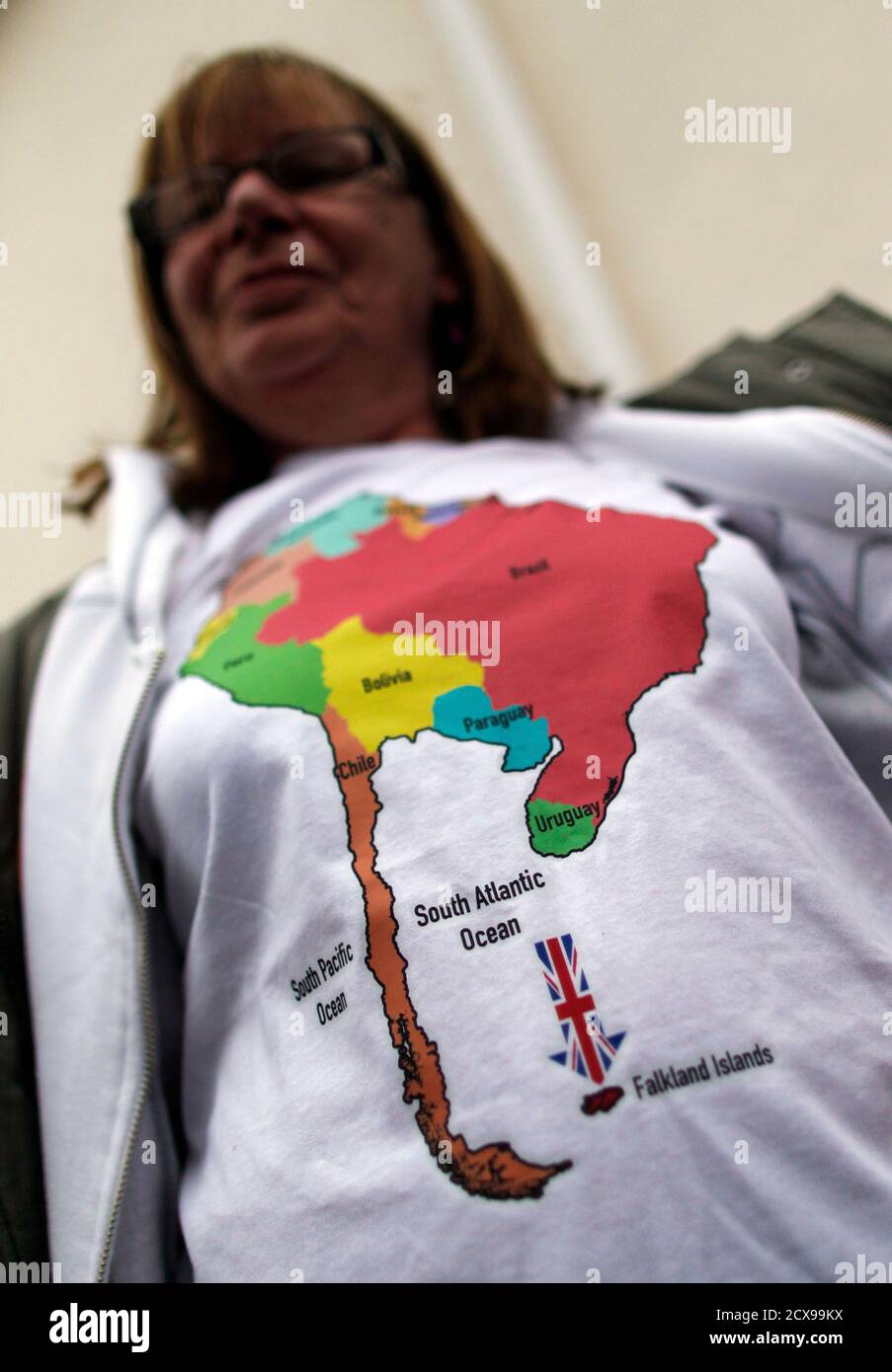 falkland-islander-vivian-vienna-shows-off-her-t-shirt-as-she-lines-up-to-cast-her-vote-at-the-town-hall-polling-station-in-stanley-march-10-2013-voters-in-the-remote-british-ruled-falkland-islands-hold-a-referendum-on-their-future-today-that-seeks-to-challenge-argentinas-increasingly-vocal-sovereignty-claim-the-drawing-on-the-t-shirt-is-a-map-of-south-america-that-does-not-include-argentina-reuters-marcos-brindicci-falkland-islands-tags-politics-elections-2cx99kx.jpg