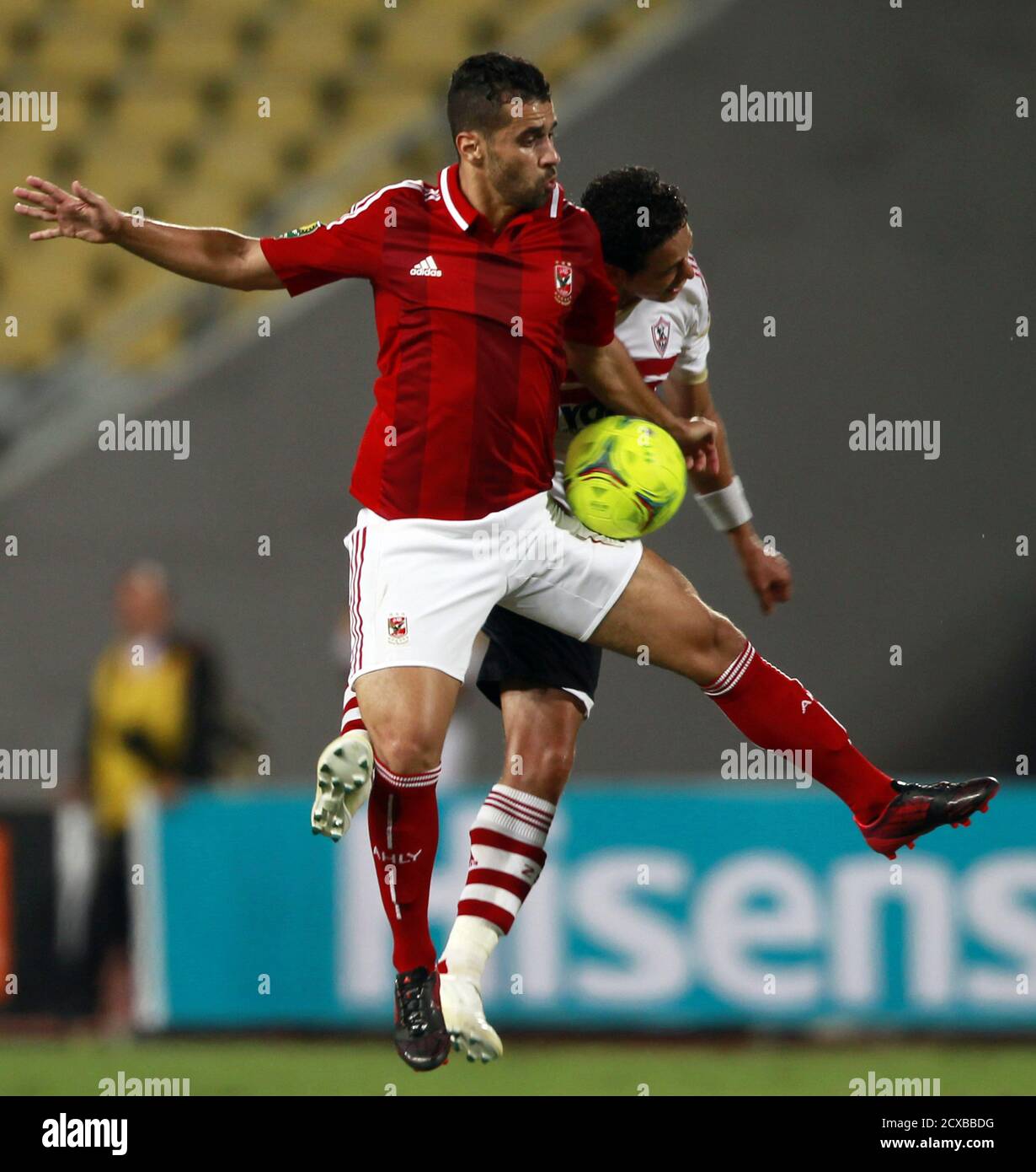 Abdallah El Said of Egypt's Al Ahly (L) fights for the ball with Ibrahim  Salah of Egypt's Zamalek during their CAF Champions League derby soccer  match at Borg El Arab "Army Stadium",