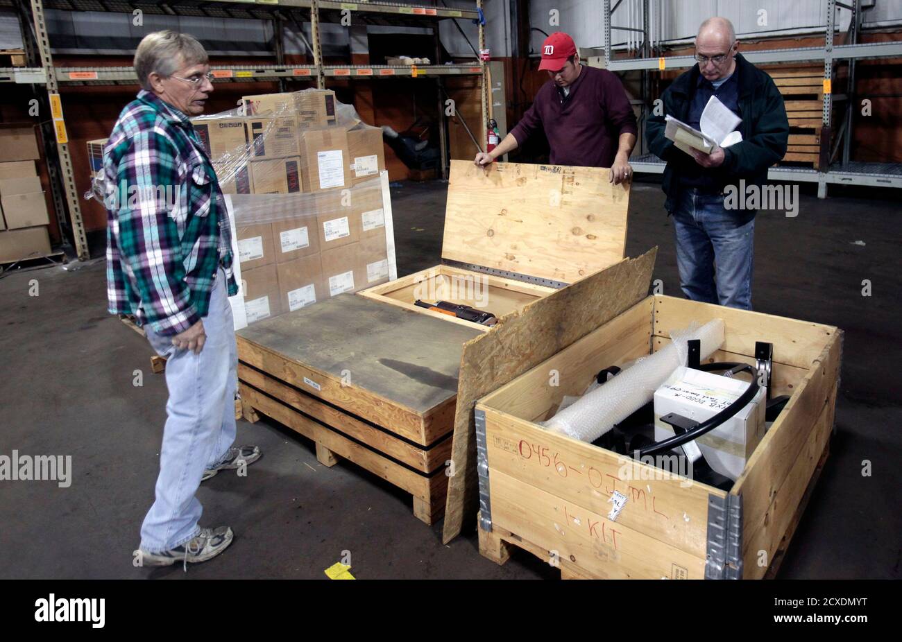 Larry Heilman L David Ozzello C And Dennis Roy Look At Manufacturing Equipment During A Liquidation Auction At The General Motors Now Closed Pontiac Assembly Plant Which Used To Build Full Size Pickup