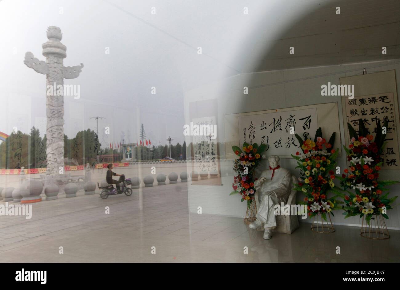 A Statue Of The Late Chairman Mao Zedong Sits Outside A Souvenir Shop Near Dong Fang Hong Square In Nanjie Village Of Luohe City In China S Central Henan Province September 25 12