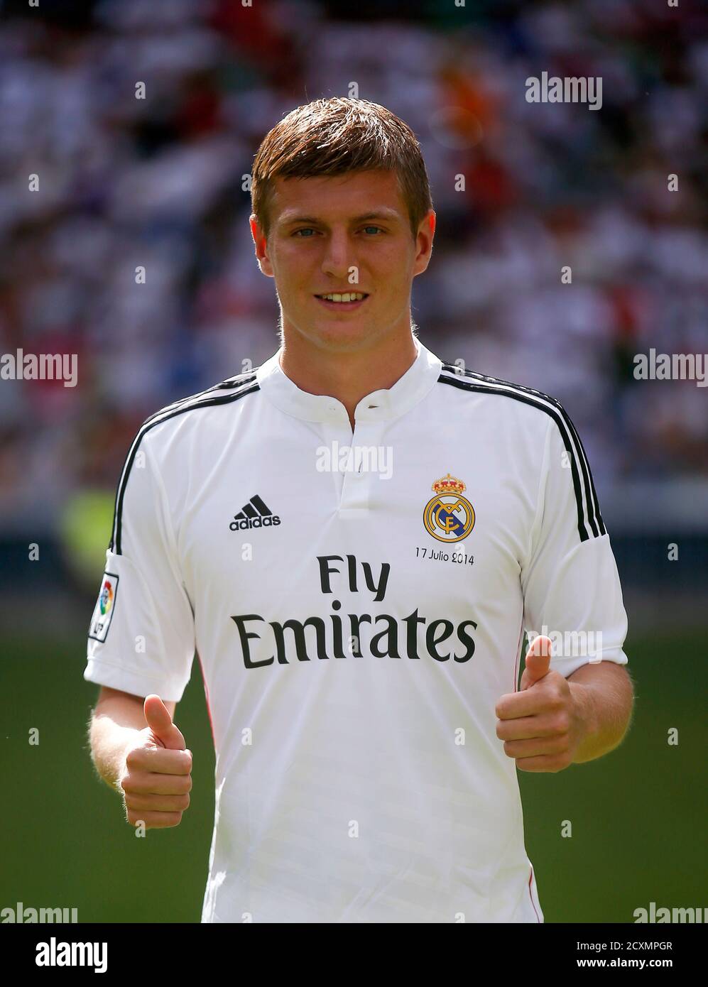 New Real Madrid midfielder Toni Kroos of Germany poses during his presentation at Santiago Bernabeu stadium in Madrid July 17, 2014. has signed a six-year deal to join Madrid from