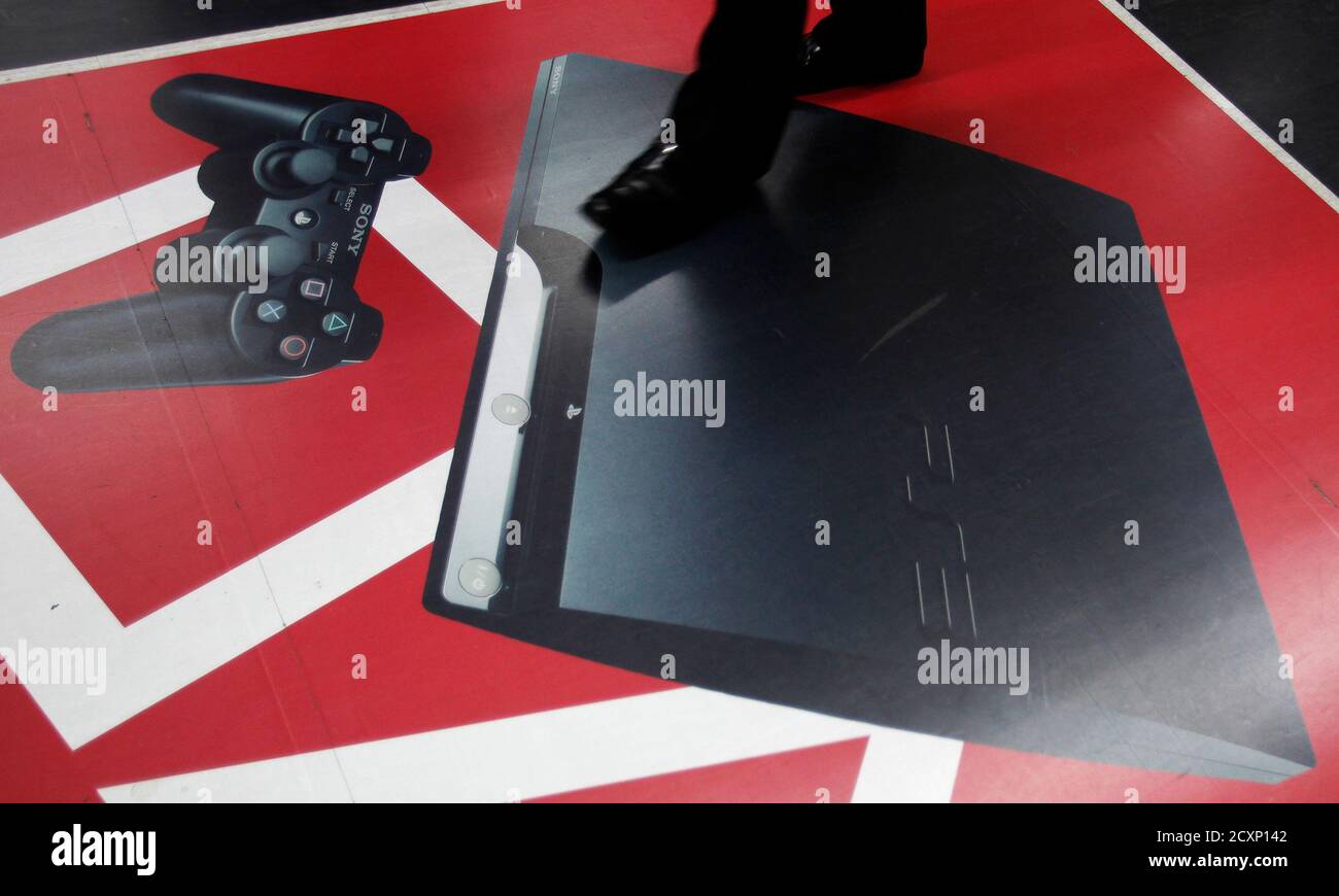 A man walks on a floor advertisement of Sony Corp's PlayStation 3 game  console at an electronic store in Tokyo April 27, 2011. Sony suffered a  massive breach in its popular PlayStation