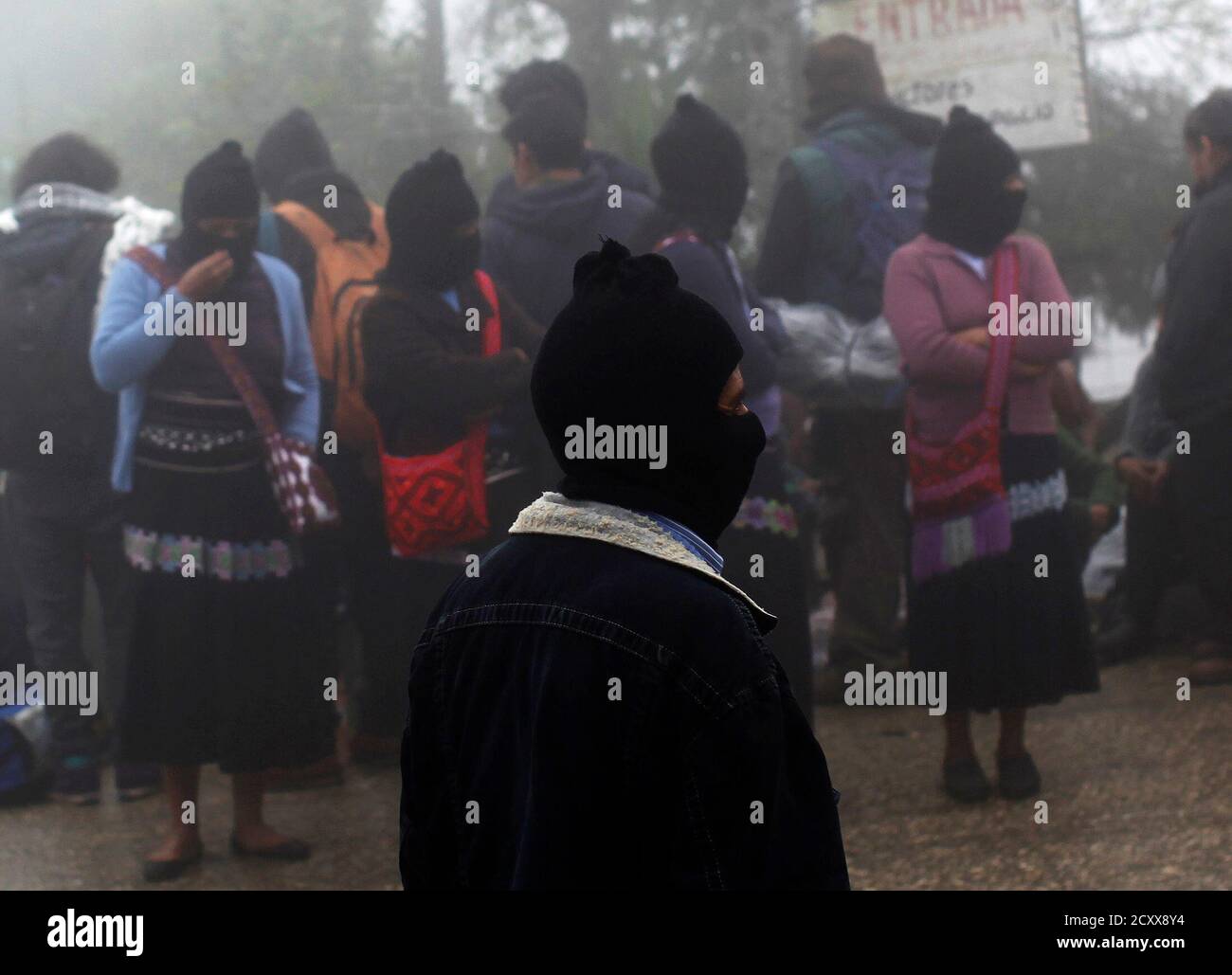 Zapatistas and followers of the Zapatista movement wait to enter the area  for 20th anniversary celebration of the armed indigenous insurgency in  Oventic December 31, 2013. Twenty years after Marcos led armed