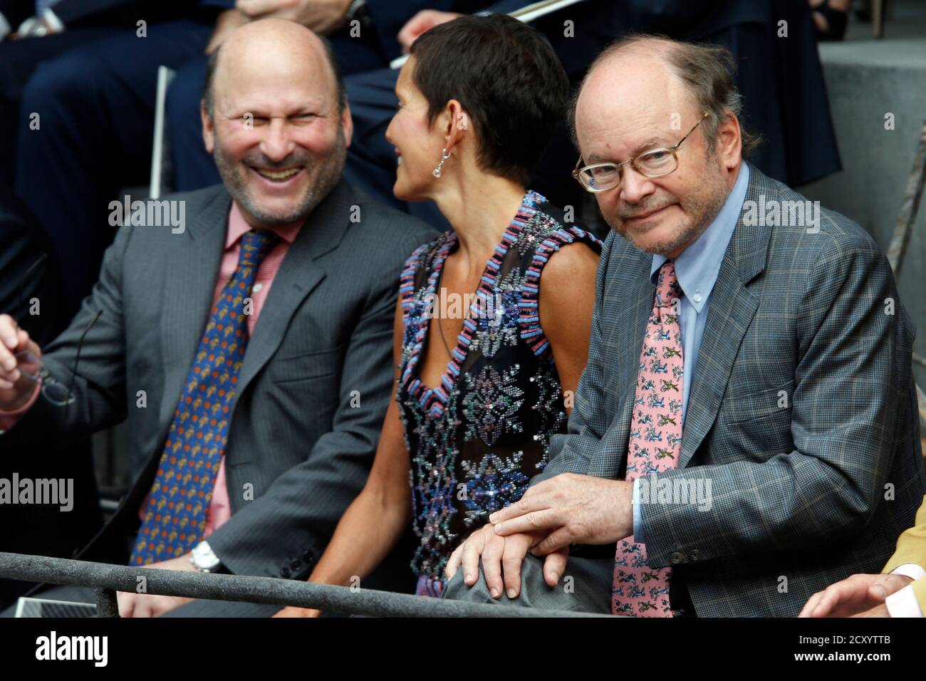 Alain Wertheimer (L) and his brother Gerard (R), co-owners of fashion house  Chanel, attend the Haute Couture Fall Winter 2013/2014 fashion show by  German designer Karl Lagerfeld for French fashion house Chanel