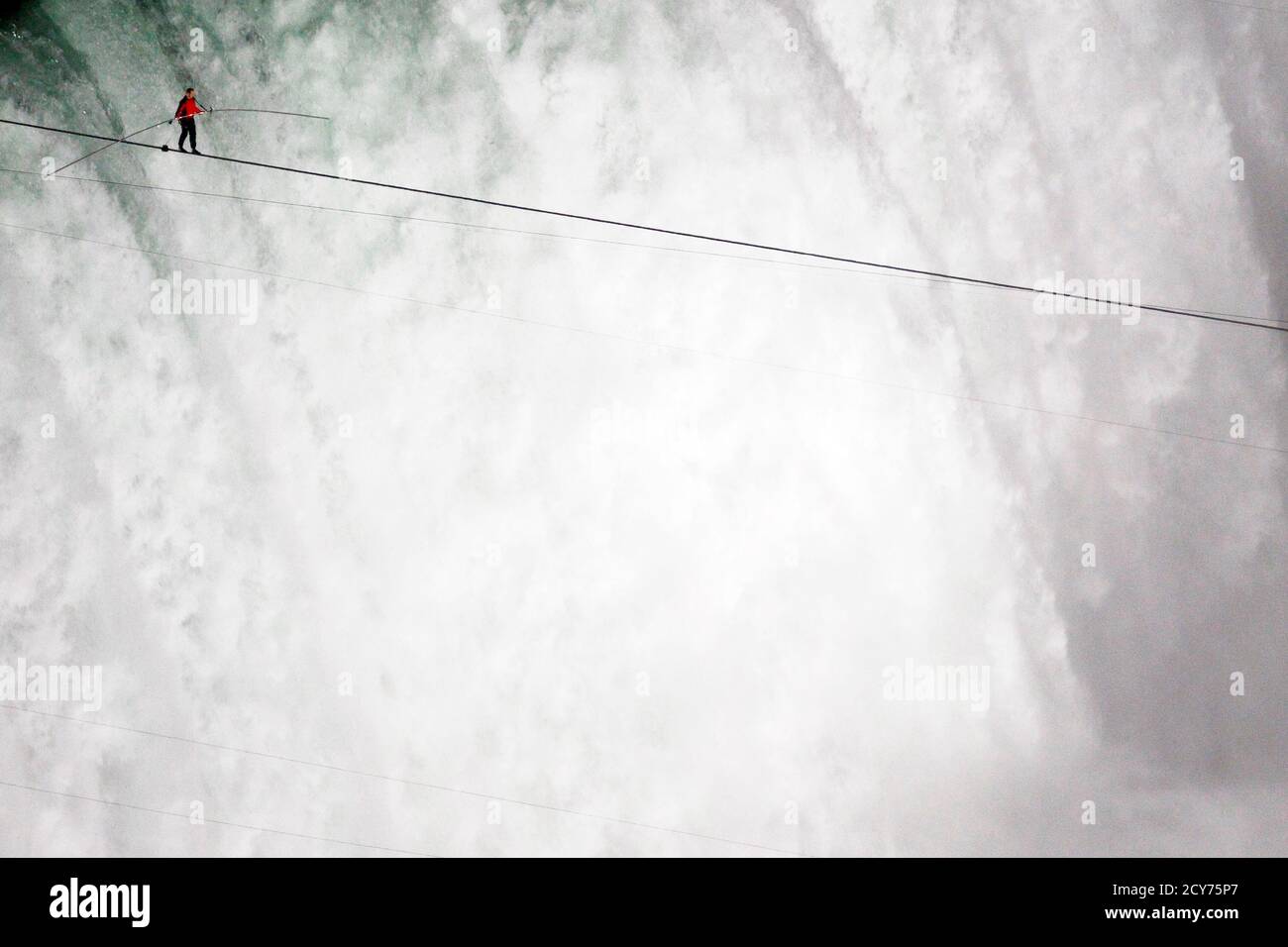 Tightrope walker Nik Wallenda walks the high wire from the U.S. side to the  Canadian side