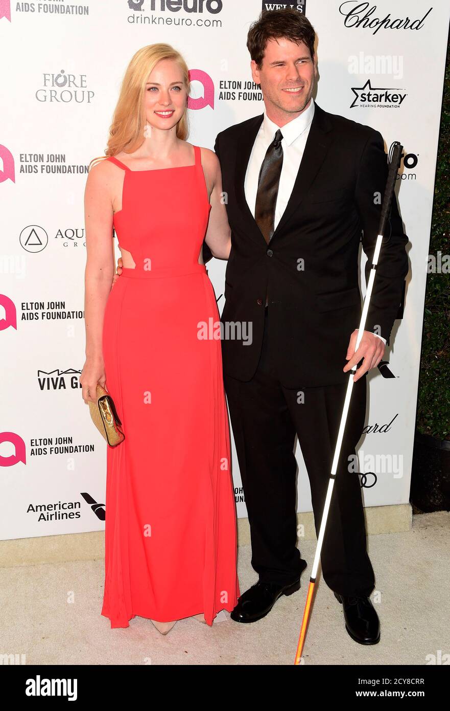 Actress Deborah Ann Woll and E.J. Scott arrive  at the 2015 Elton John AIDS Foundation Oscar Party in West Hollywood, California February  22, 2015.  REUTERS/Gus Ruelas (UNITED STATES  - Tags: ENTERTAINMENT) (OSCAR-PARTIES) Foto de stock