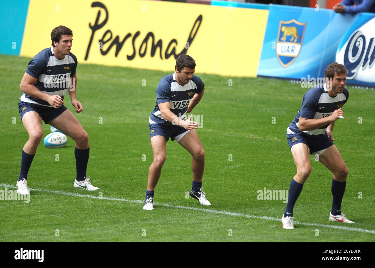 Manuel Carizza (L-R), Martin Landajo and Juan Martin Hernandez of  Argentina's Los Pumas warm up before a practice session at the Estadio  Unico in La Plata September 28, 2012. Argentina's Los Pumas