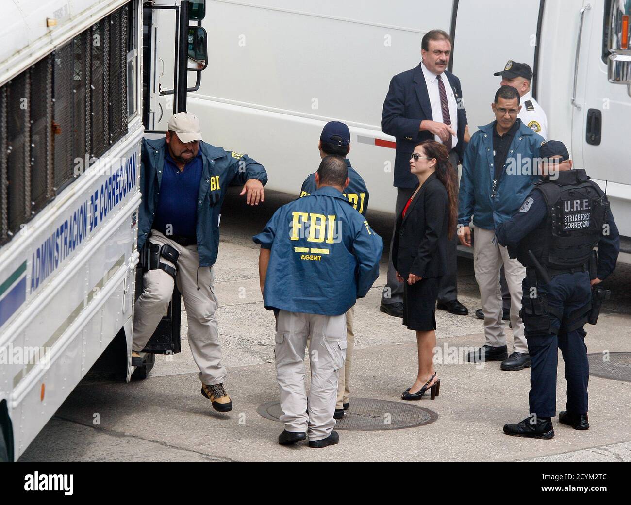 FBI agents arrive with police officers and prison guards arrested in a  major anti-corruption operation across the U.S. Caribbean territory to the Puerto  Rico Federal Court Building in San Juan, October 6,