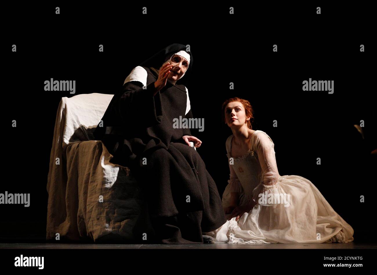 Singers Deborah Polaski (L) and Patricia Petibon perform on stage during a dress rehearsal of Francis Poulenc's opera "Dialogues des Carmelites" at Theater an der Wien in Vienna April 13, 2011. The opera is conducted by Bertrand de Billy and will premiere on April 16. REUTERS/Herwig Prammer (AUSTRIA - Tags: ENTERTAINMENT SOCIETY) Foto de stock