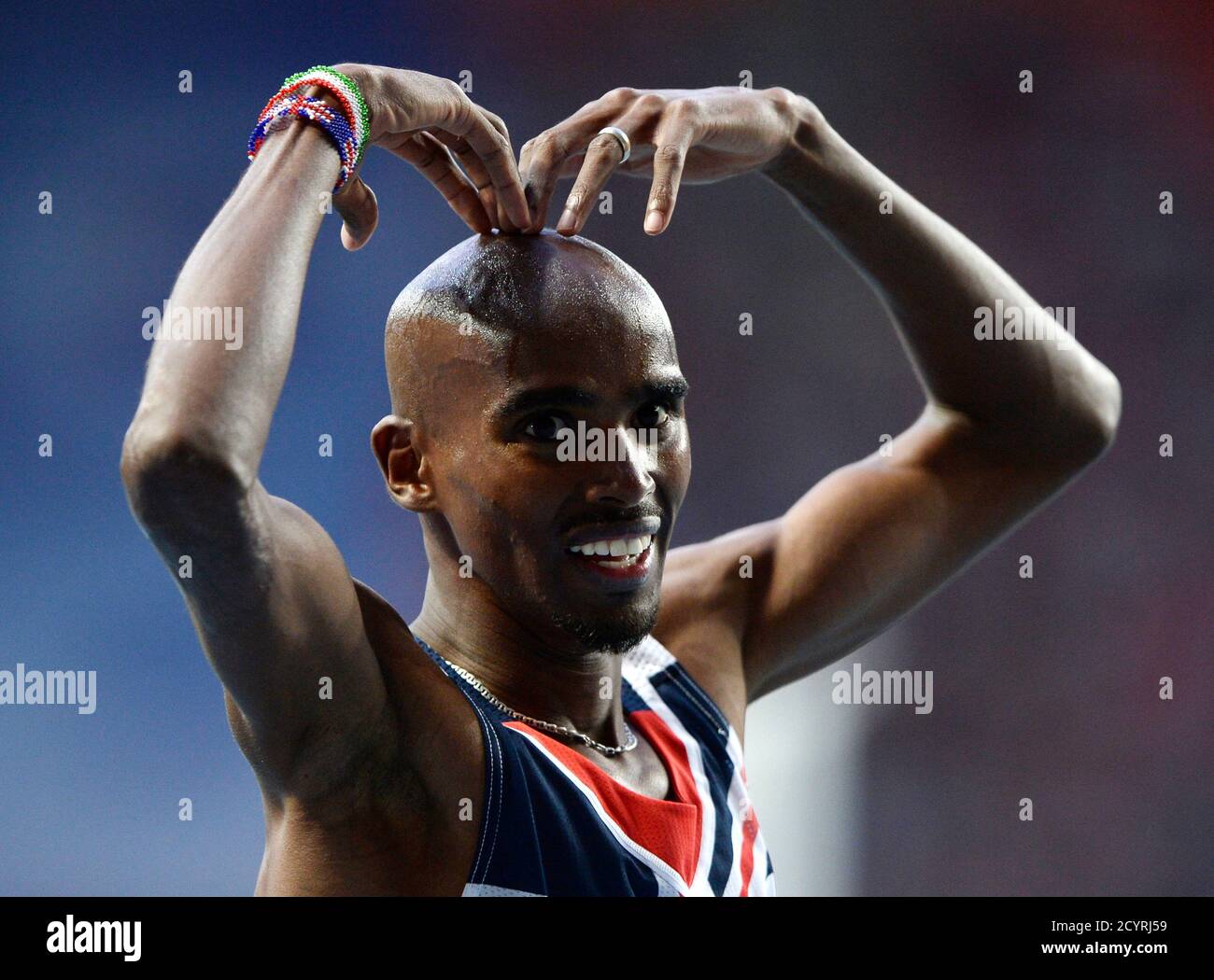 Mo Farah of Britain makes the 'Mobot' pose as he celebrates winning the  men's 5,000 metres final during the IAAF World Athletics Championships at  the Luzhniki stadium in Moscow August 16, 2013.