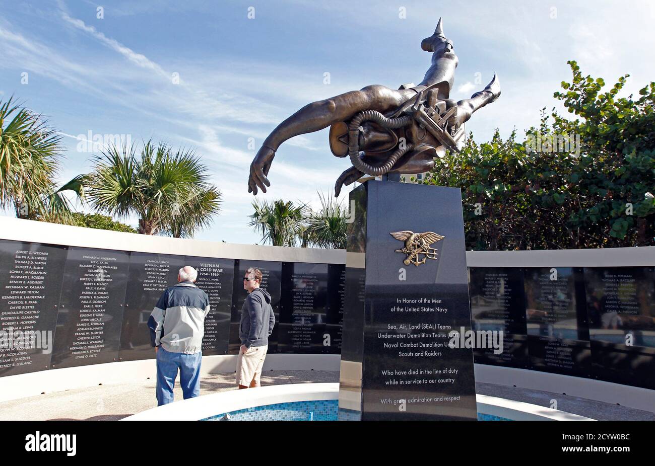 Guests view a memorial to U.S. Navy Underwater Demolition Team (UDT