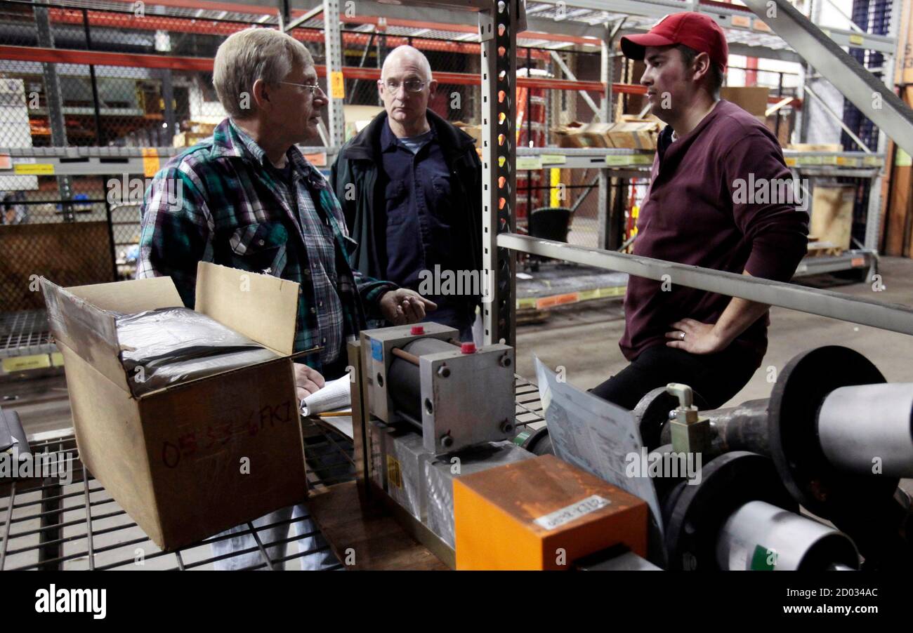 Larry Heilman L Dennis Roy C And David Ozzello Look At Manufacturing Equipment During A Liquidation Auction At The General Motors Now Closed Pontiac Assembly Plant Which Used To Build Full Size Pickup