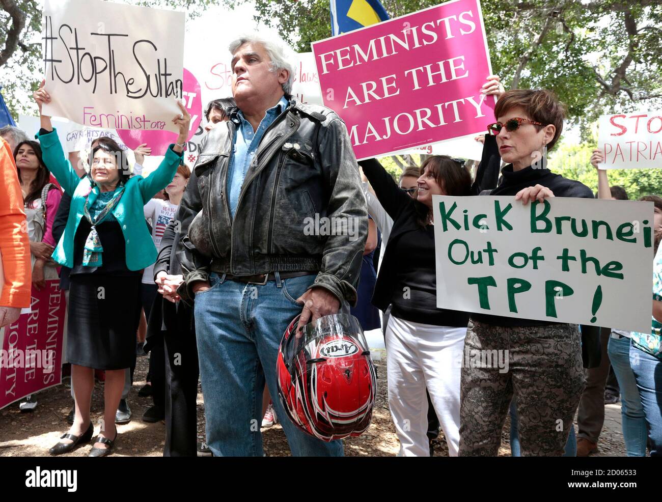 TV personality Jay Leno (C) attends a rally protesting against Brunei's new  strict sharia law penal code outside the Beverly Hills Hotel, which is  owned by the Sultan of Brunei, in Beverly