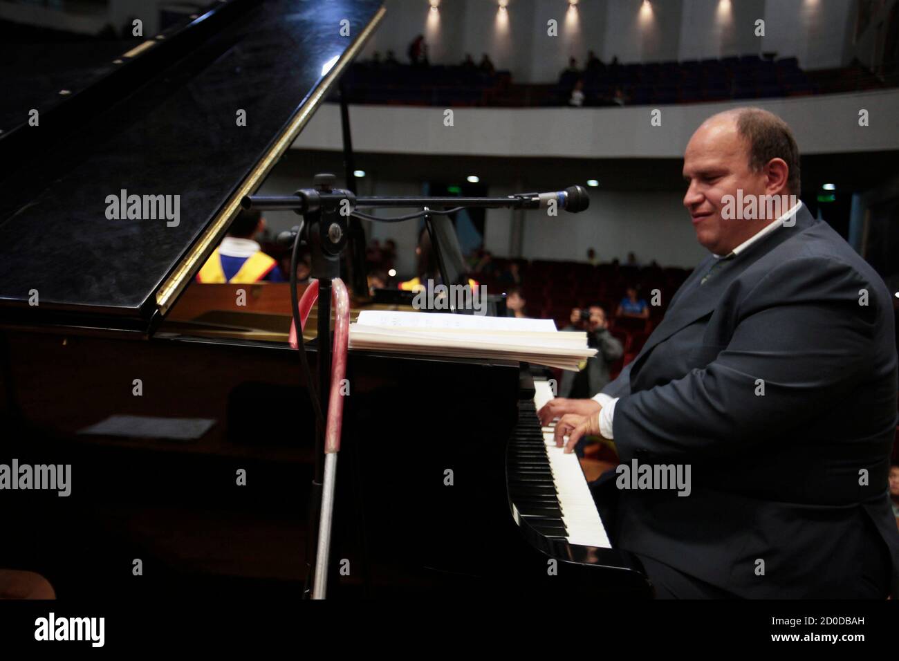 Francisco Morales, a visually impaired musician of the Santa Lucia Chorus,  plays the piano during a performance in the conservatory in Guatemala City  July 22, 2012. The Santa Lucia Chorus, which is