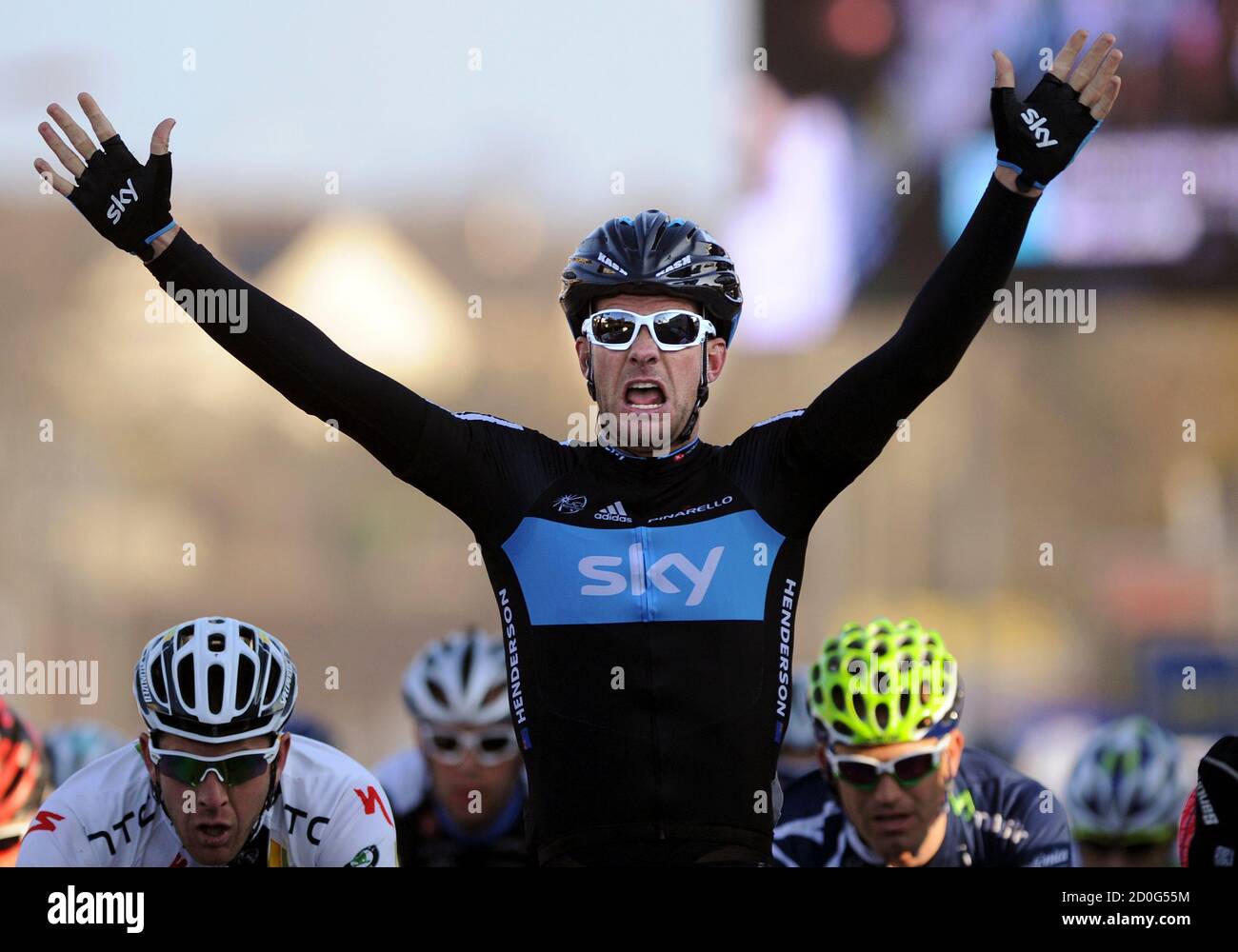 Sky team rider Gregory Henderson of New Zeland (C) celebrates winning the second of Paris Nice cycling race between and Amilly March 7, 2011. REUTERS/Eric Gaillard (FRANCE - Tags: SPORT